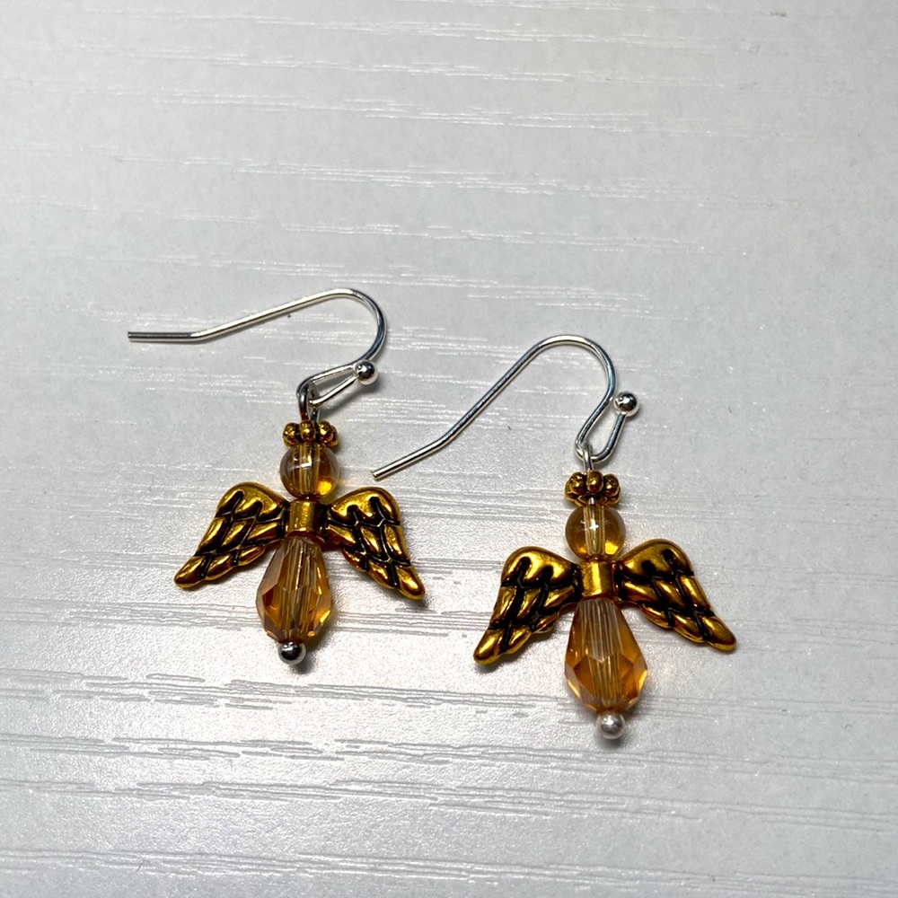 Handmade gold and pale brown beaded earrings.